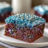 A vibrant Galaxy Graduation Cake adorned with shimmering edible stars and a marbled buttercream galaxy design.  