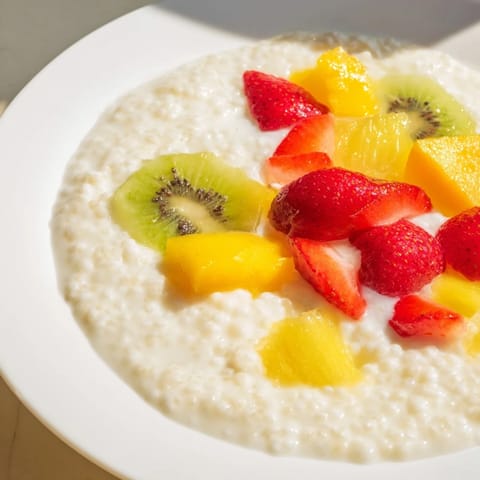 Creamy tapioca pudding with translucent pearls, ready to be topped with fresh mixed berries.