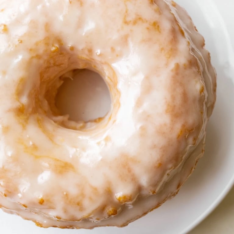 Warm, fluffy cake donuts, featuring a light and airy interior, perfect with cinnamon sugar or glaze.